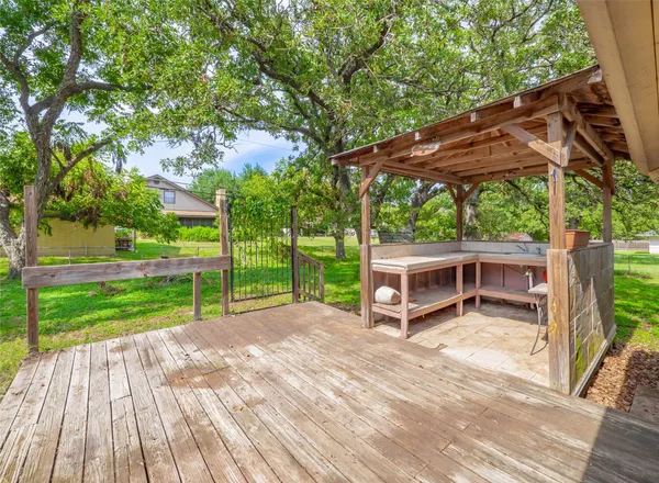 a view of a house with backyard and a patio