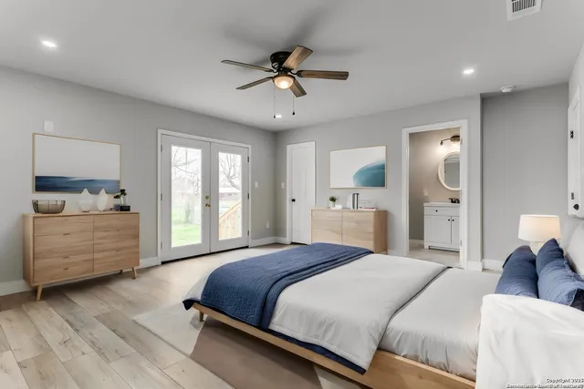 a spacious bedroom with a large bed and a window