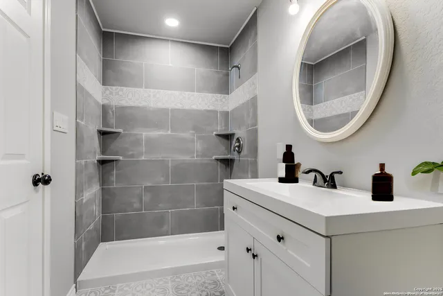 a bathroom with a sink and a mirror