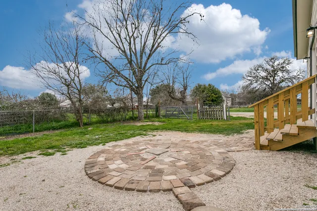 a view of a park with large trees