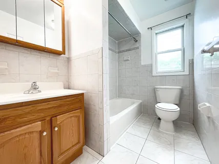a bathroom with a sink a toilet and bathtub