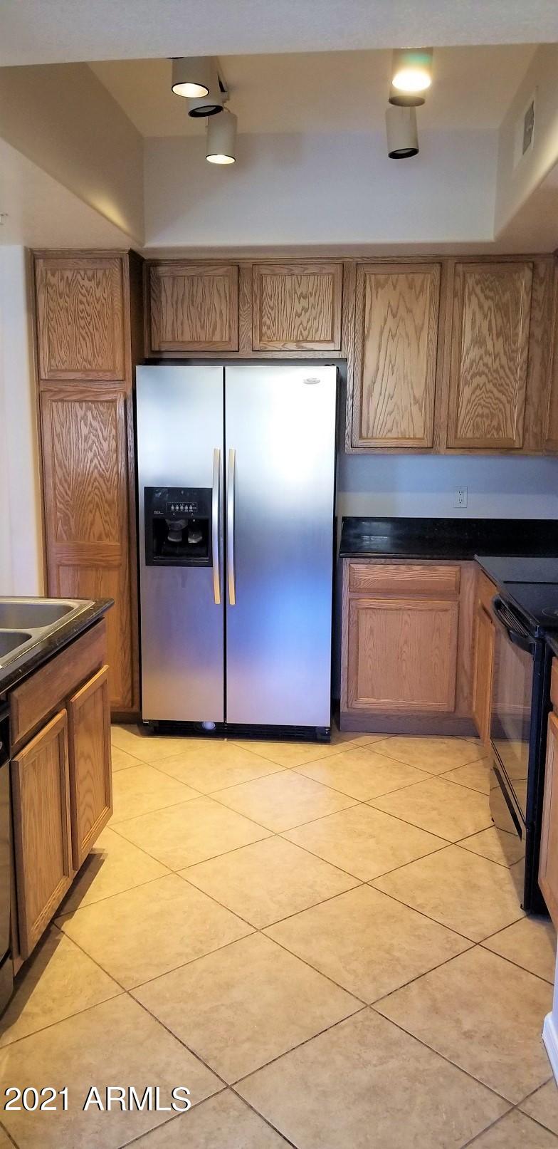 2402 East 5th Street, Unit 1686 Tempe, AZ 85288 - Photo 13 of 25 a view of a kitchen with a sink