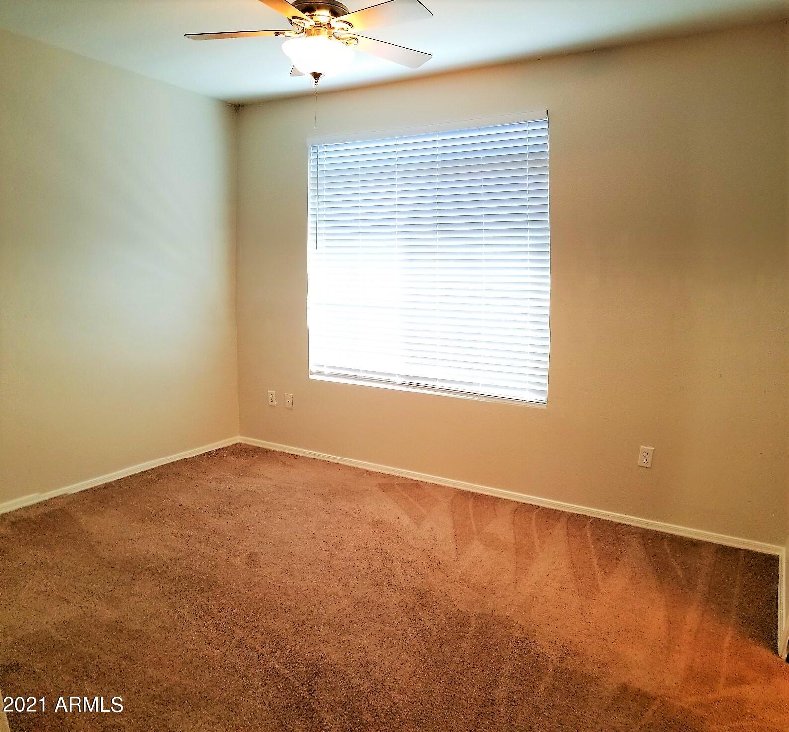 2402 East 5th Street, Unit 1686 Tempe, AZ 85288 - Photo 14 of 25 an empty room with a window