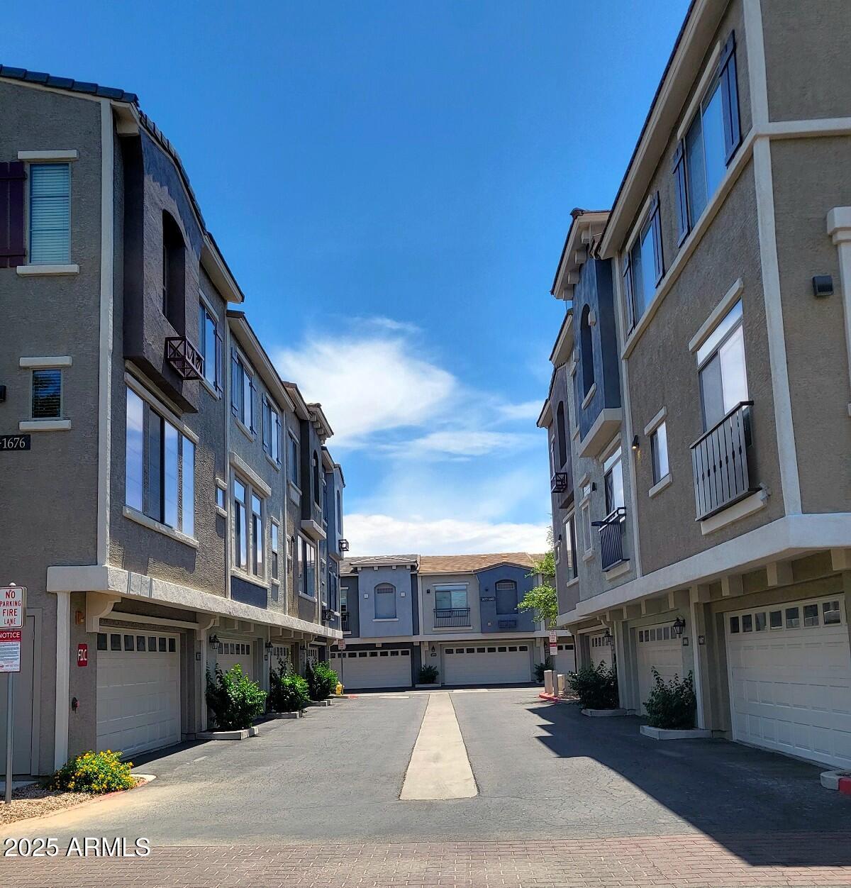 2402 East 5th Street, Unit 1686 Tempe, AZ 85288 - Photo 2 of 25 a street view with tall buildings