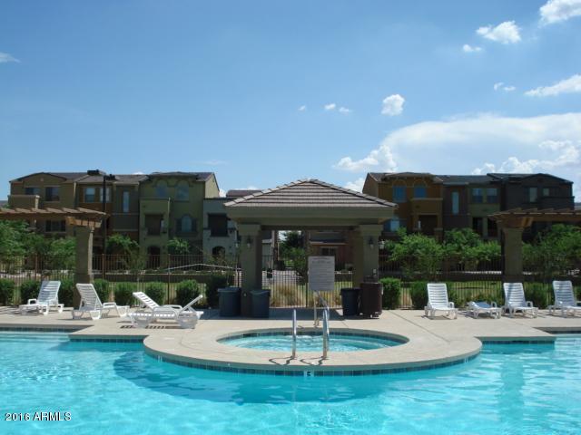 2402 East 5th Street, Unit 1686 Tempe, AZ 85288 - Photo 3 of 25 a view of a house with backyard porch and sitting area
