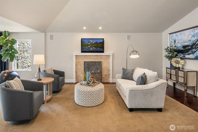 a spacious bedroom with bed and a couch