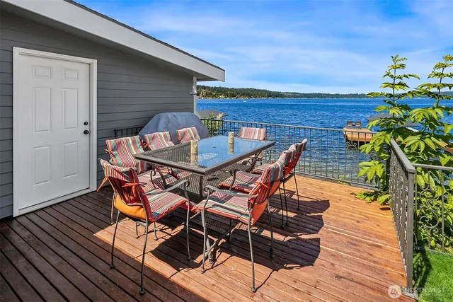 a kitchen with stainless steel appliances granite countertop a refrigerator and a stove