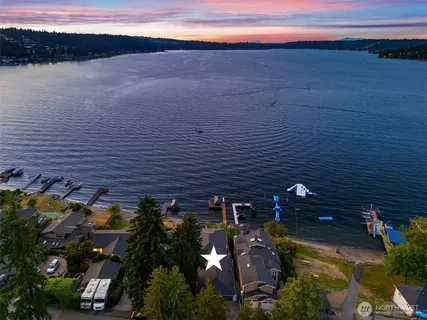 an aerial view of house with yard swimming pool and outdoor seating