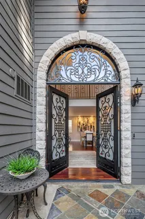 a living room with furniture fireplace and dining table