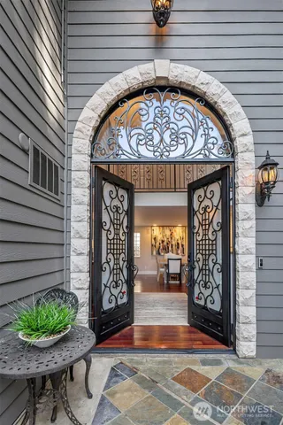 a living room with furniture fireplace and dining table