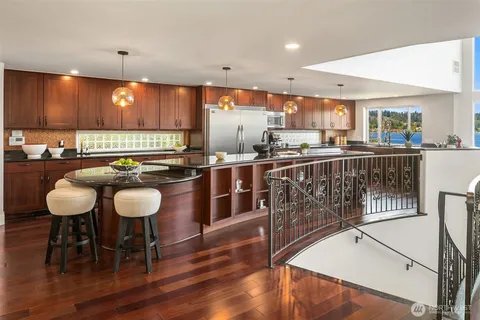 a kitchen with a table and chairs