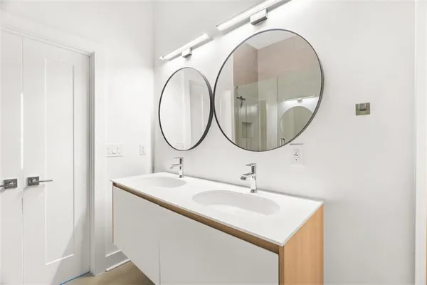 a bathroom with a sink and a mirror