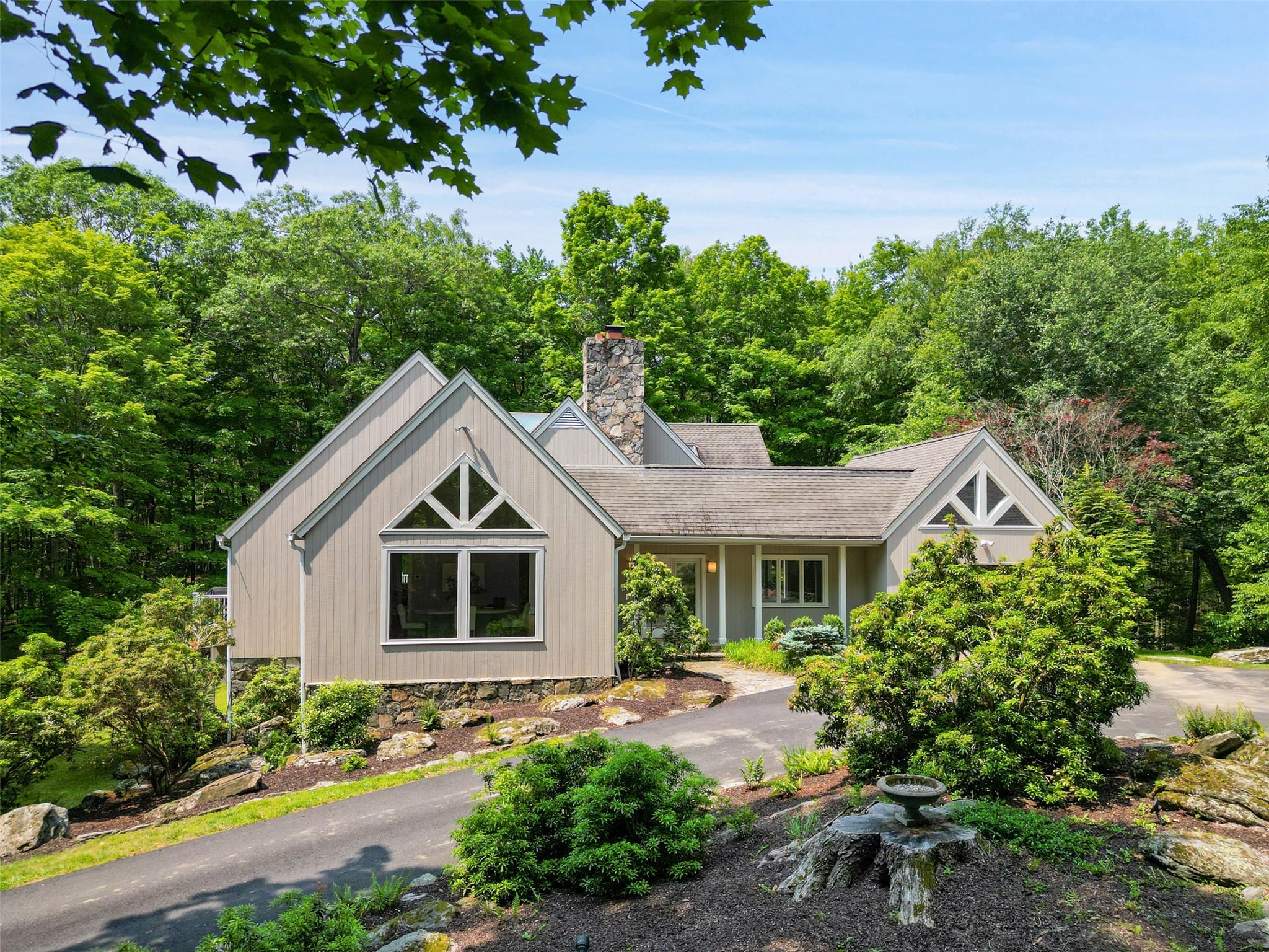 a front view of a house with garden