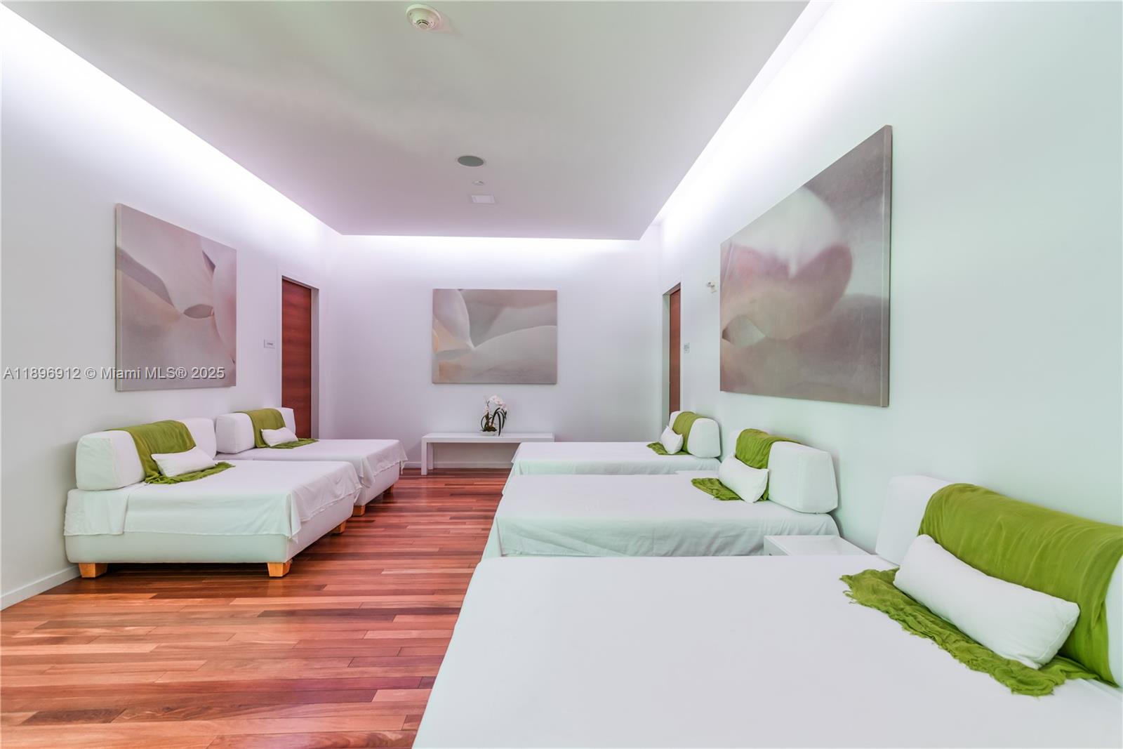 1040 Biscayne Boulevard, Unit 2402 Miami, FL 33132 - Photo 11 of 17 a bedroom with a bed and a couch