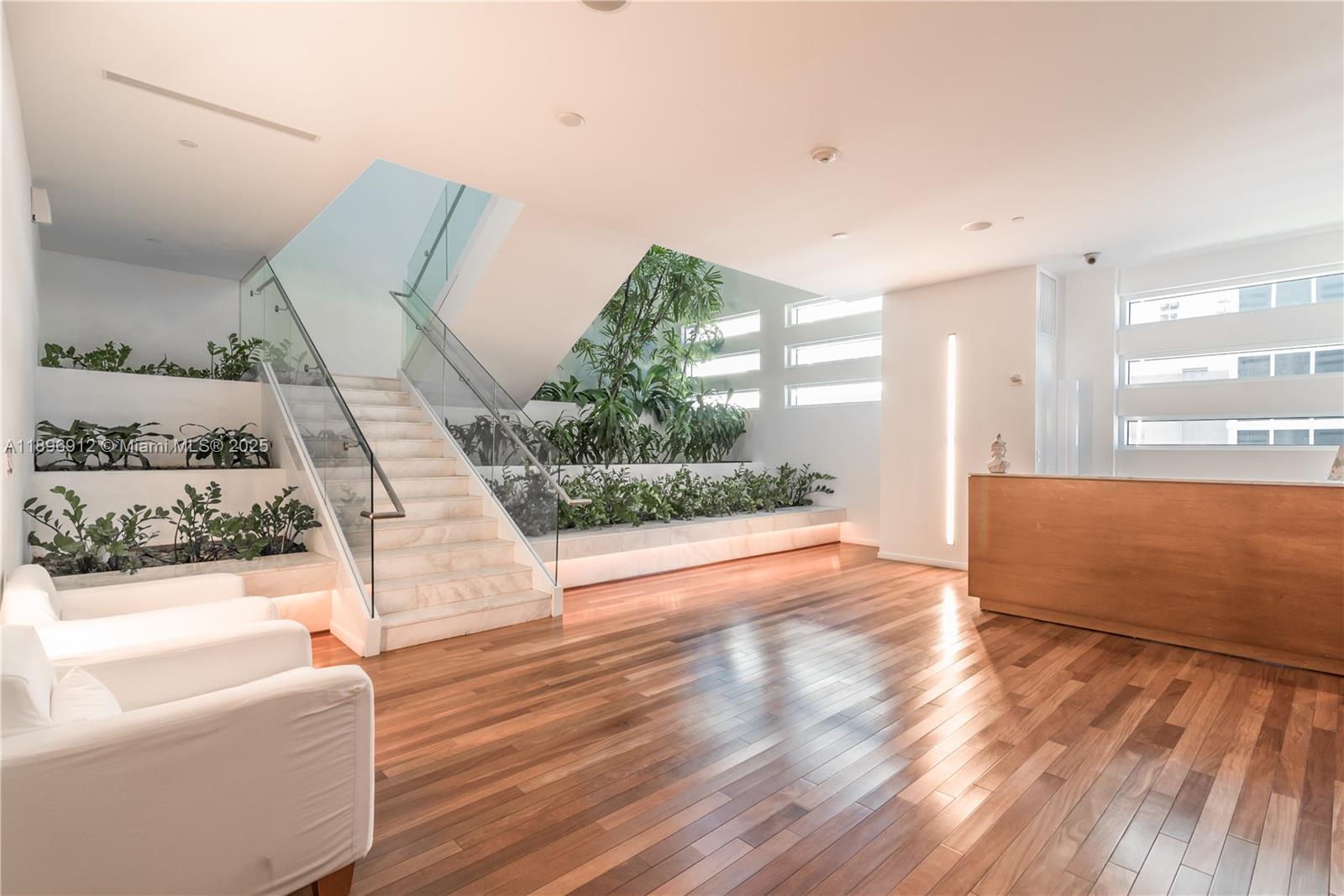 1040 Biscayne Boulevard, Unit 2402 Miami, FL 33132 - Photo 13 of 17 a view of a living room and a floor to ceiling window