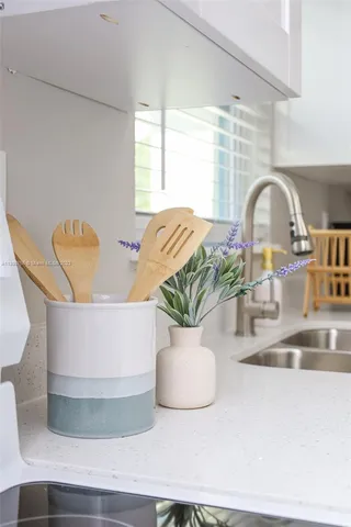 a view of a dining table with potted plant