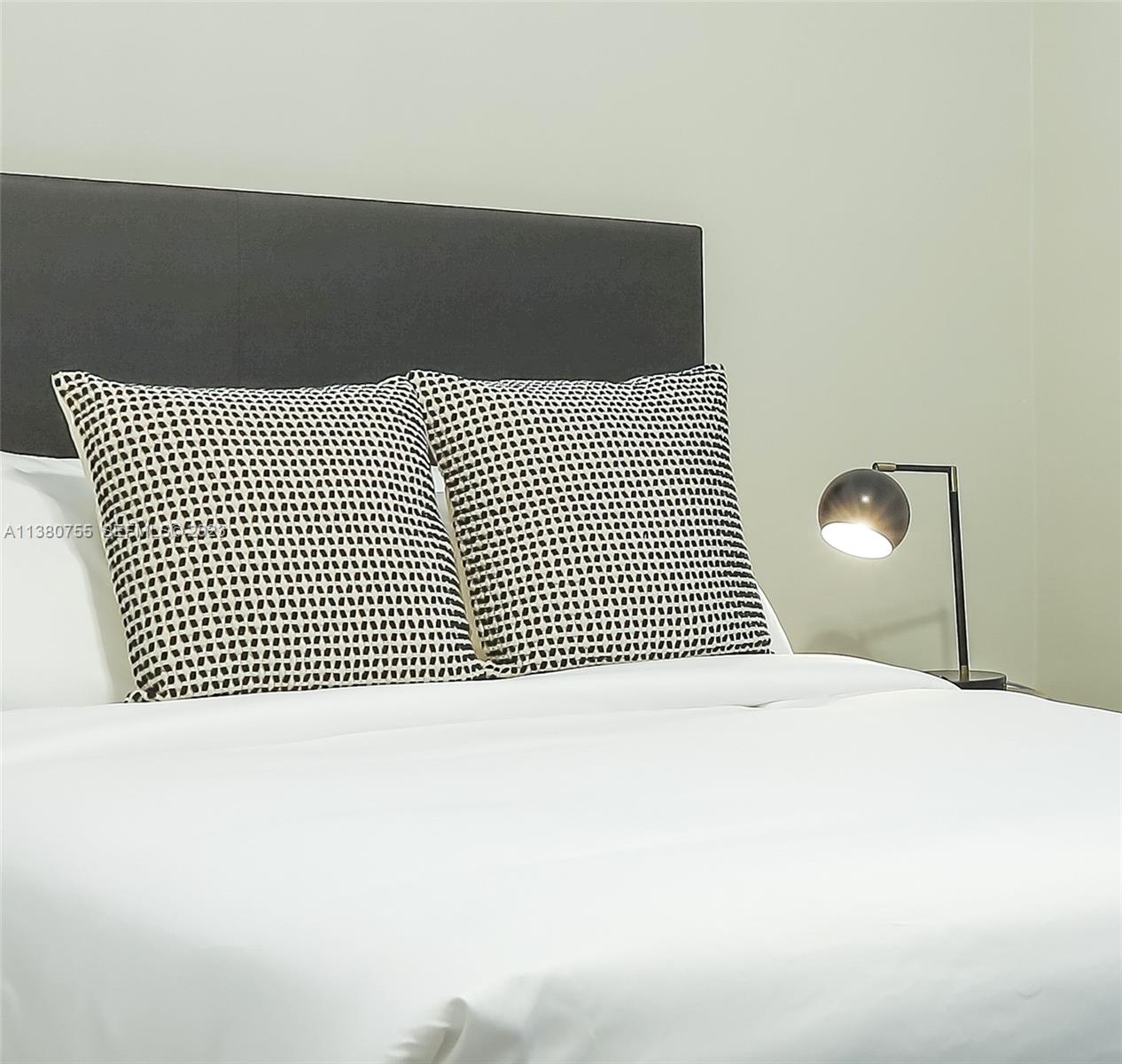 2761 Southwest 33rd Avenue, Unit 1 Miami, FL 33133 - Photo 30 of 46 a bedroom with a bed