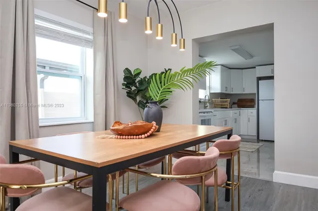 a dining room with furniture and window