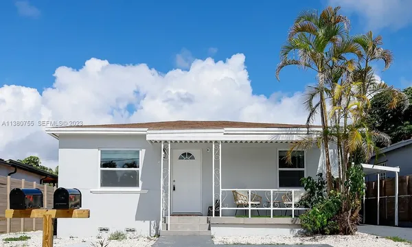a front view of a house with garage