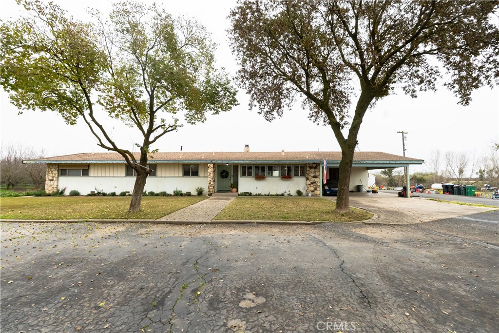 a big house with trees in front of it