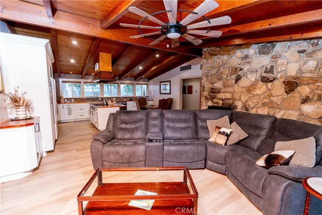 a bedroom with two beds and a flat screen tv