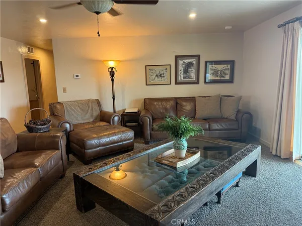 a bedroom with a bed and a dresser in it