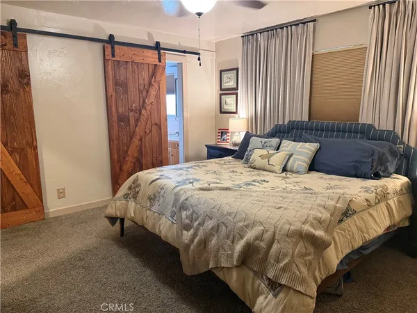 a kitchen with refrigerator and window