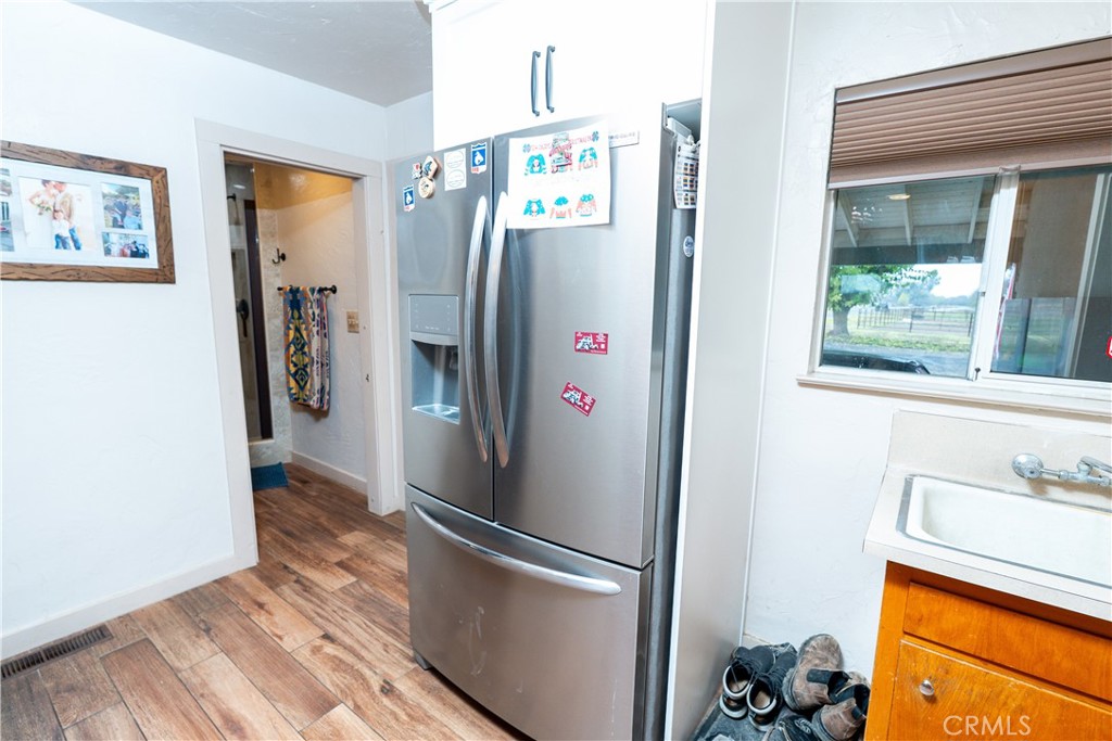 25565 Road 13 Chowchilla, CA 93610 - Photo 23 of 64 a view of walk in closet with clothes and shoes