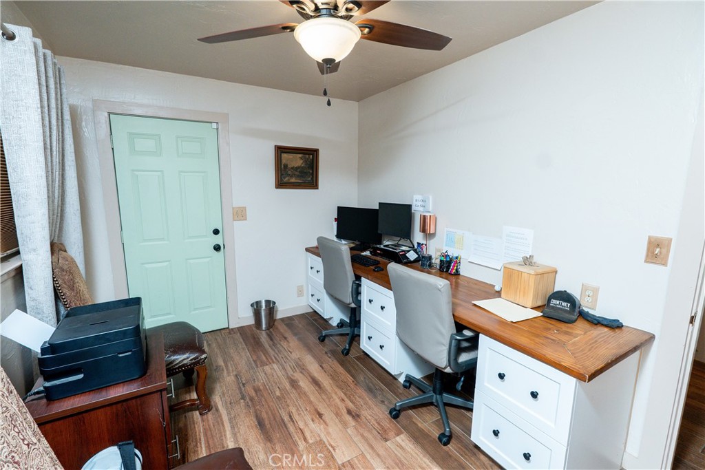 25565 Road 13 Chowchilla, CA 93610 - Photo 25 of 64 a view of a workspace with furniture and a window