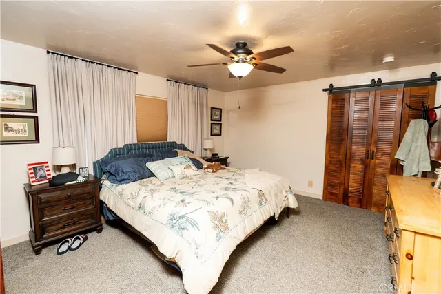 a spacious bathroom with a double vanity sink a mirror and shower