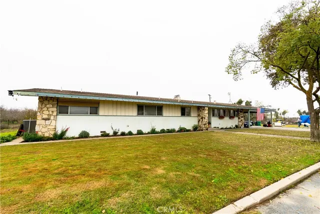 a big house with trees in front of it