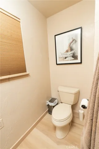 a aerial view of a house with swimming pool and a yard