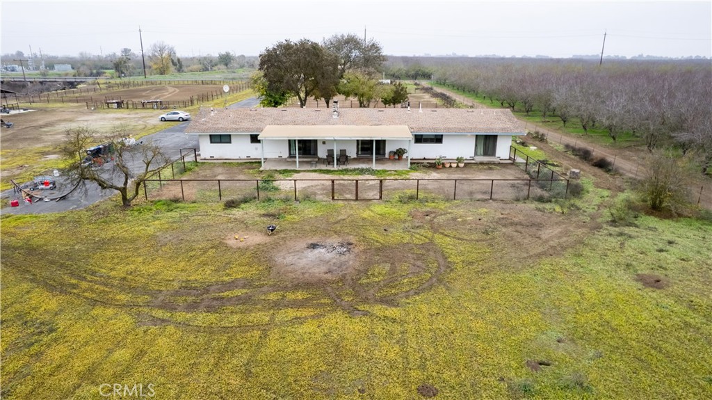 25565 Road 13 Chowchilla, CA 93610 - Photo 44 of 64 a aerial view of a house with swimming pool and a yard