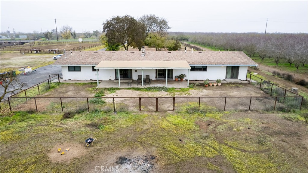 25565 Road 13 Chowchilla, CA 93610 - Photo 45 of 64 a view of a big yard next to a lake