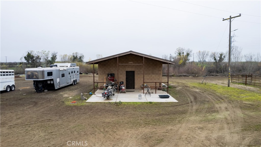 25565 Road 13 Chowchilla, CA 93610 - Photo 54 of 64 a view of a house with sitting area and furniture