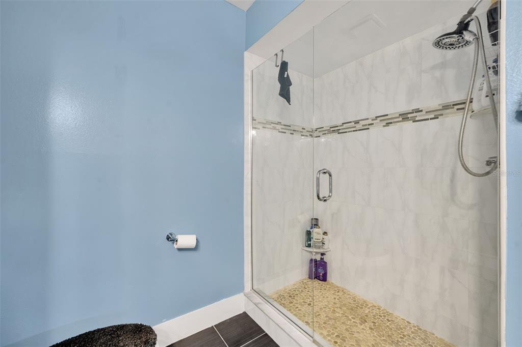 5377 Vineland Road, Unit 1D Orlando, FL 32811 - Photo 20 of 25 a bathroom with a shower and a sink