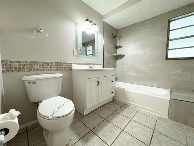 a bathroom with a sink a toilet and a bathtub