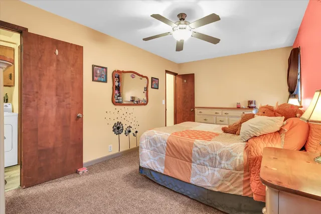 a view of a livingroom with a chandelier fan