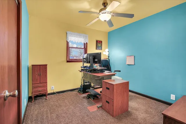 a workspace room with furniture