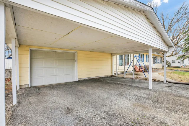 a picture of a room with a white wall and sign