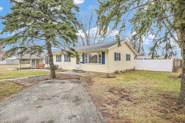 a house with trees in front of it