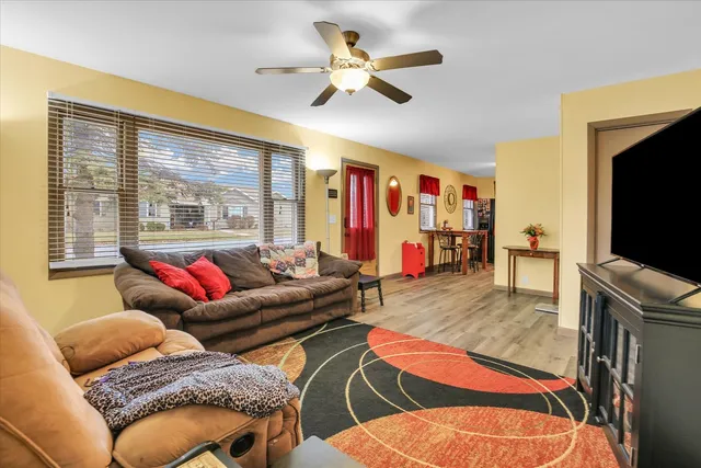 a kitchen with stainless steel appliances a stove a sink dishwasher and cabinets with wooden floor