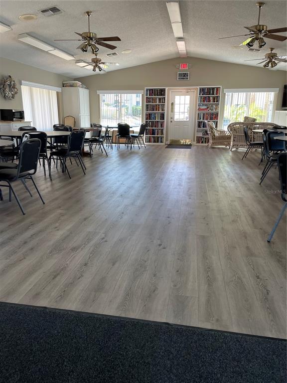 2655 Pine Ridge Way North, Unit D3 Palm Harbor, FL 34684 - Photo 29 of 31 a view of a dining room with furniture and window