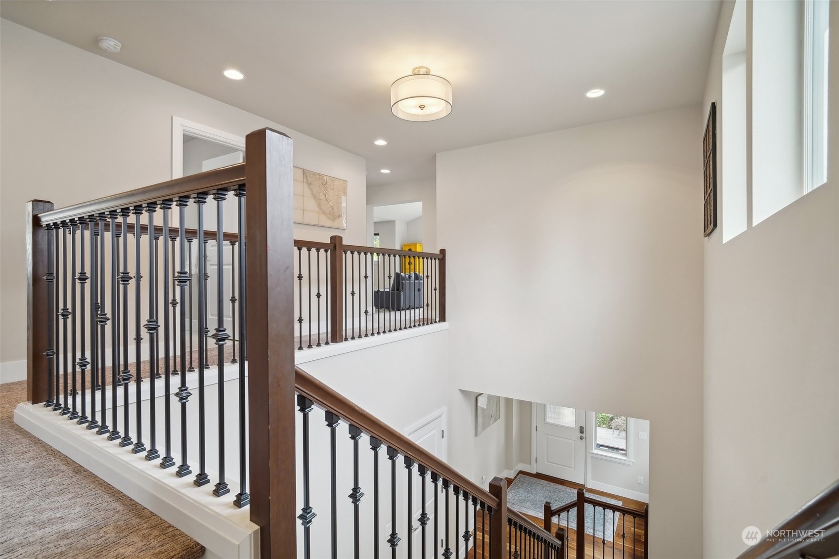 4111 Strumme Road Bothell, WA 98012 - Photo 14 of 39 a view of staircase with railing and a chandelier