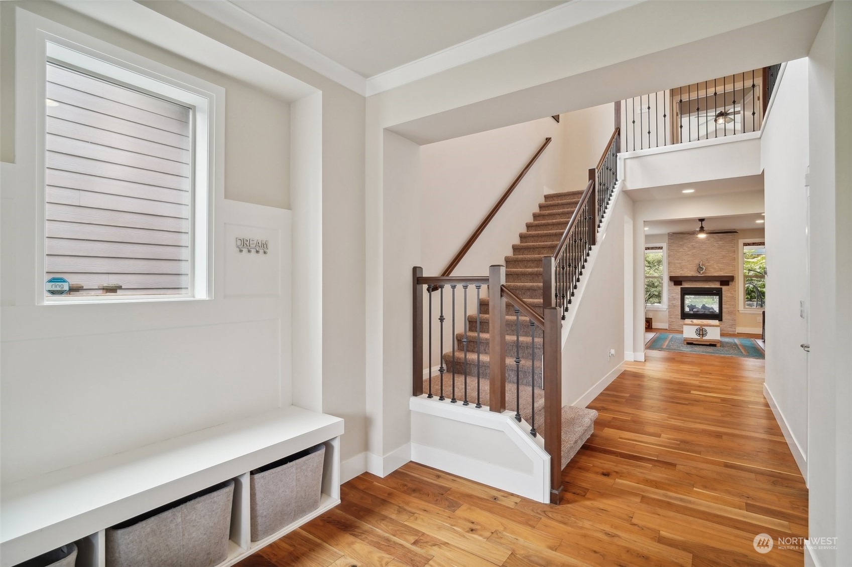 4111 Strumme Road Bothell, WA 98012 - Photo 4 of 39 a view of a hallway with wooden floor and staircase