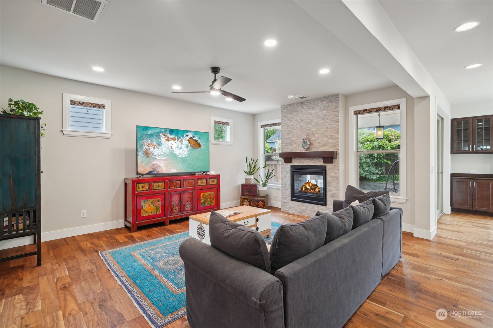 4111 Strumme Road Bothell, WA 98012 - Photo 6 of 39 a living room with furniture and a fireplace