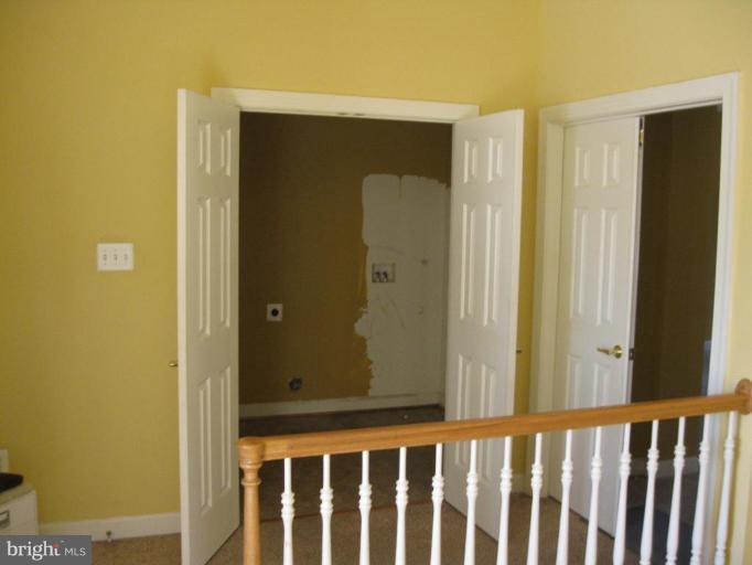 8932 Ricky Trevor Road Perry Hall, MD 21128 - Photo 7 of 16 a view of a wooden door and a window