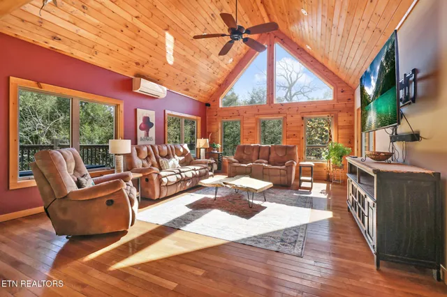 a building outdoor space with patio furniture and wooden floor