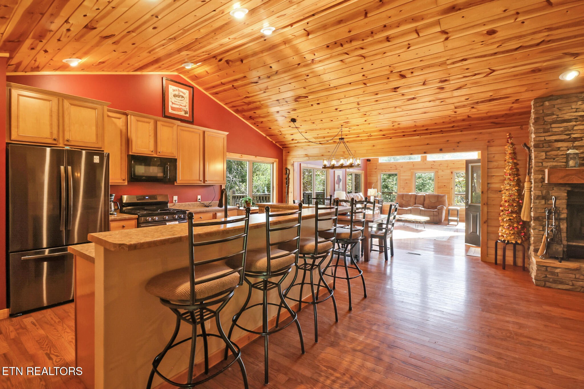232 Victoria Circle Jamestown, TN 38556 - Photo 13 of 58 a view of a dining room with furniture a chandelier and wooden floor