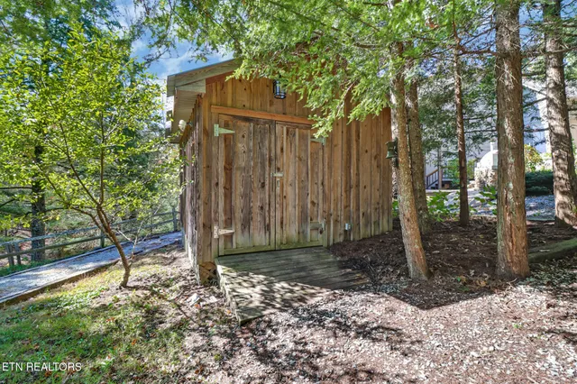 a view of a deck with wooden floor and a yard